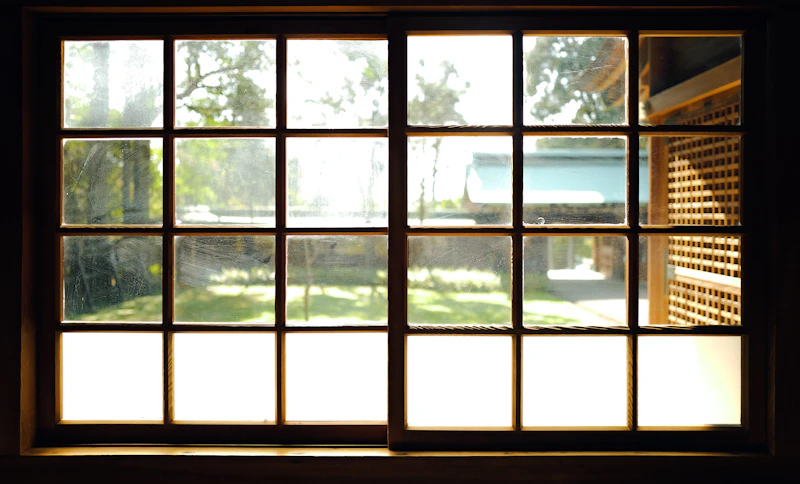 Demonstration of proper squeegee angle on residential window